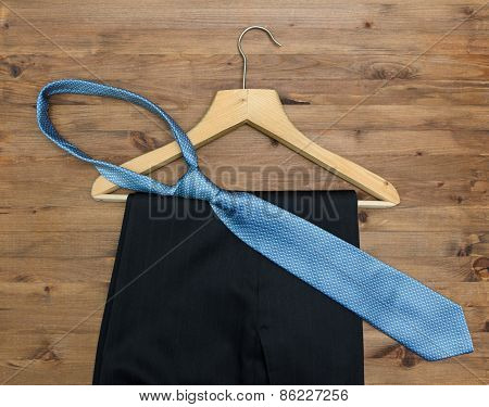 Wooden Hanger With  Tie And Trousers