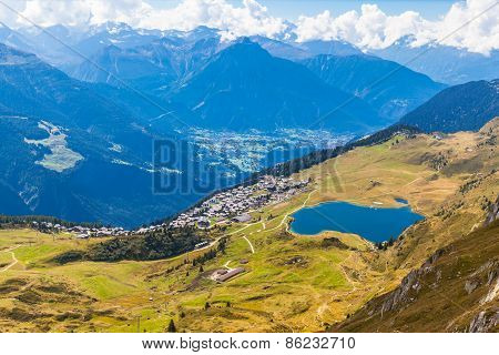 Bettmersee (lake) And The Alps In Valais