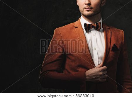 Sharp dressed fashionist wearing jacket and bow tie