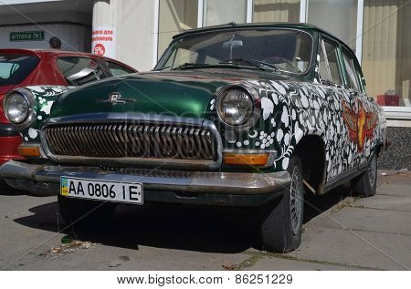 KIEV, UKRAINE - MAR 16: exterior of the vintage Soviet car GAZ-21 Volga with folk stile tuning on March 16, 2015 in Kiev,Ukraine