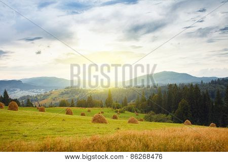 mountain and stacks of straw