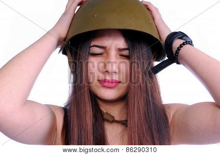 The girl is holding her aching head