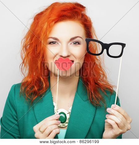 Attractive playful young woman ready for party - falce lips and glasses  