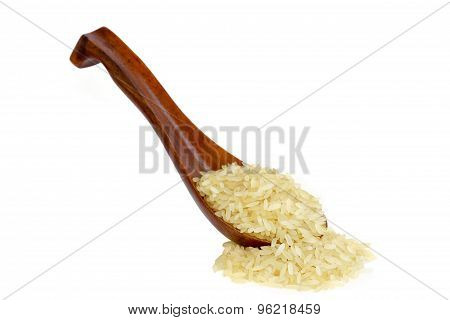 parboiled long grain rice in wooden spoon