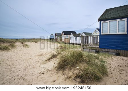 Lovely Beach Huts On Sand Dunes And Beach Landscape
