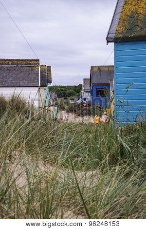 Lovely Beach Huts On Sand Dunes And Beach Landscape