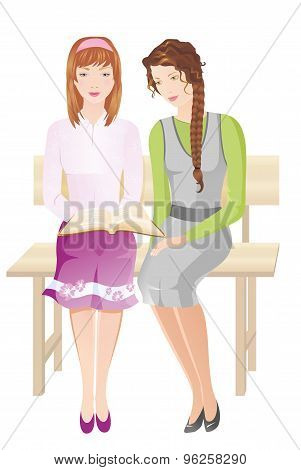 Two girls reading Bible