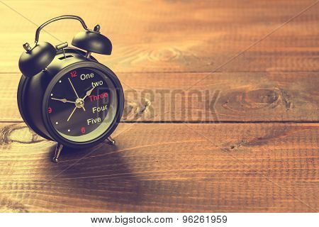 Alarm Clock On Wood Table