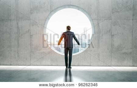 Blank interior and man in a suit.