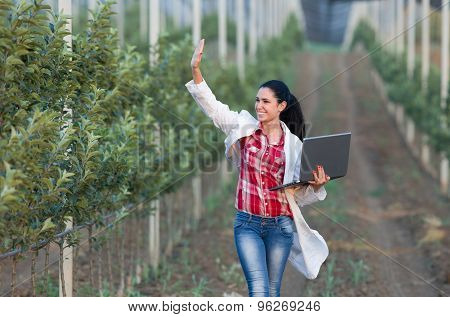 Woman Agronomist In Orchard