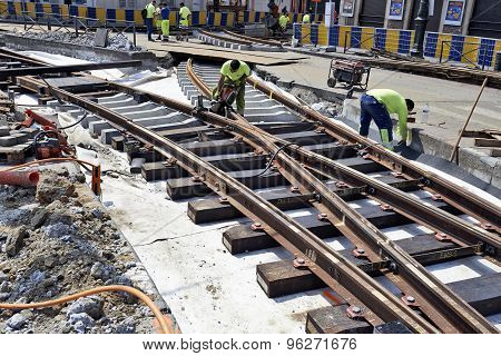 Some Workers Repair And Replace Some Rail Trams