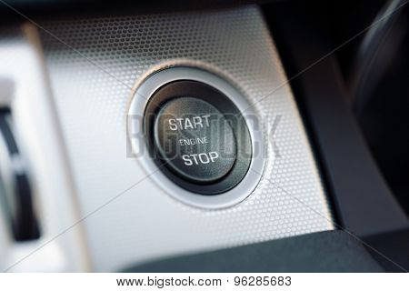 Engine start and stop button on electric hybrid car dashboard