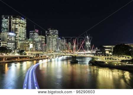Brisbane Cityscape and Kurilpa Bridge at night, citycat trails