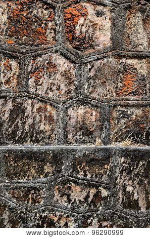 Texture of a stone wall of abandoned christian church on top of Bokor mountain in Preah Monivong national park, Kampot, Cambodia