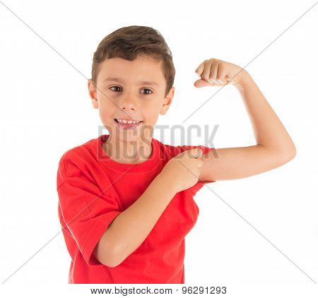 Young boy showing his muscles