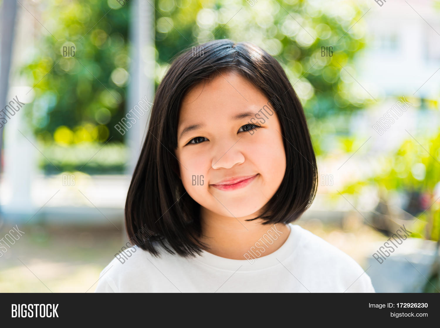 Asian teen girl face close up think Asian teen girl face close up