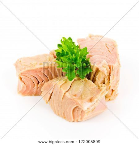 pieces of tuna with parsley isolated on white