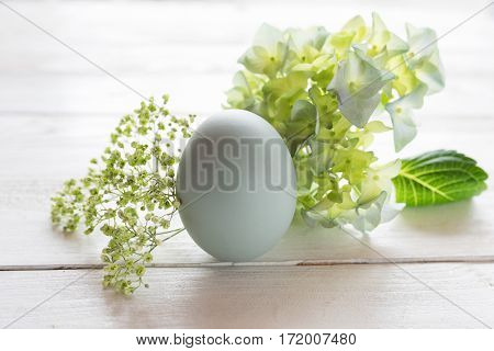 Tender easter decoration on a white wooden table