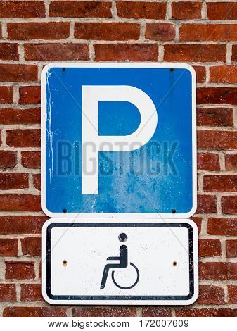 Close-up of a dirty parking sign for disable people