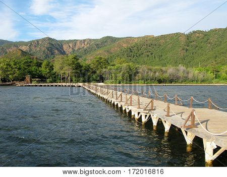 long bridge to the beach in the mediterranean seacoast