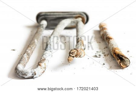 Damaged Heating Element of the Washing Machine on White Background.