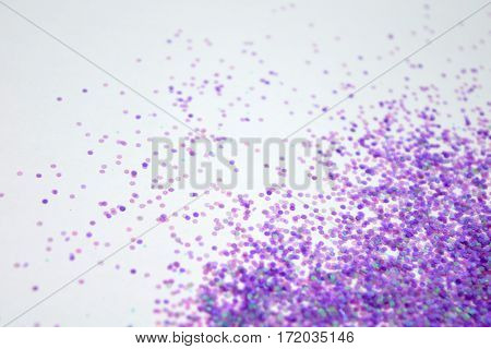 glitter purple on a right angle white background.