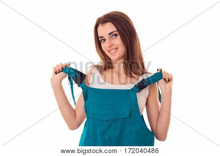 portrait of young sexy brunette woman take off her bulder uniform and smiling on camera isolated on white