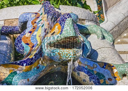 Barcelona, Spain - Jan 5, 2017: Lizard mosaic sculpture in Park Guell of Barcelona, Spain. Dragon salamandra fontaine designed by Gaudi