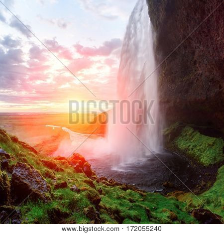 Sunrise on Seljalandfoss waterfall on Seljalandsa river, Iceland, Europe.