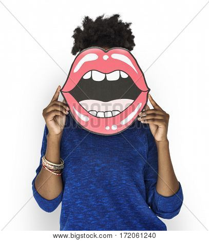African Woman holding Peper Mouth Over her Face