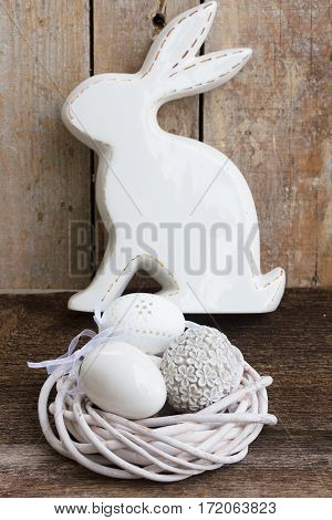 Easter eggs hunt - Bunny with nest of white eggs