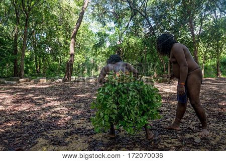 Vedda people performing hunt. Veddas are an indigenous people of Sri Lanka living in tribes in the jungle