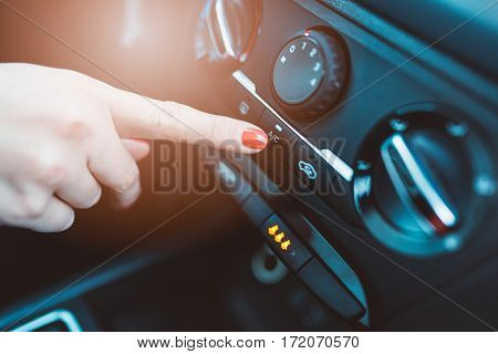 Woman Turns On Air Conditioning In Her Car