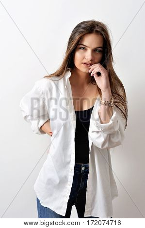Model testshoot of sensual fashion model is posing in white shirt