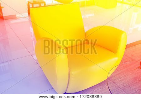 Modern yellow chair with color filters in office