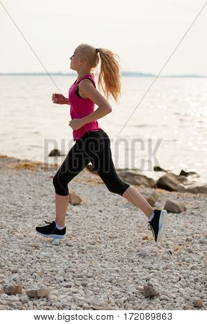Jogging In Th Beach - Woman Runns Near Sea On Early Summer Morning