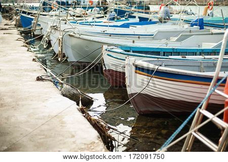 Group of small fishing boats working row-boats with fishing paraphernalia etc