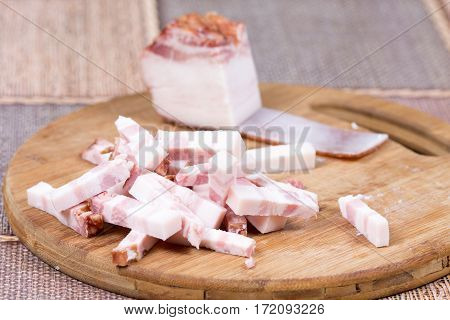 Sliced Chopped Bacon On The Kitchen Wooden Board