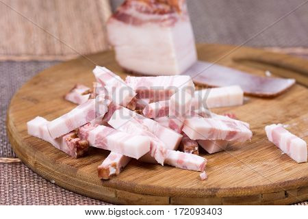 Sliced Chopped Bacon On The Kitchen Wooden Board