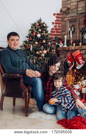Beautiful and happy family waiting for Christmas