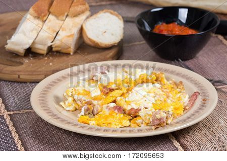 Fried eggs with bacon served on the table.