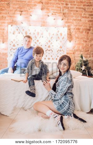 Beautiful and happy family waiting for Christmas