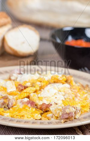Fried eggs with bacon served on the table.