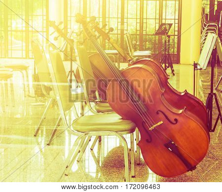 Violoncello in music room with color filters