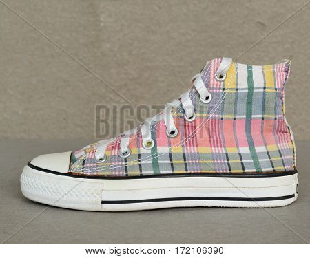 close up vintage style of sport plaid sneaker shoe isolated on white background