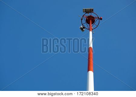 Transmission antenna radio tower pole on clear blue sky background