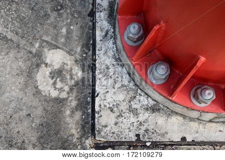 Steel bolt and nuts on steel plate for fasteners of the bottom of electric pole that red color selective focus
