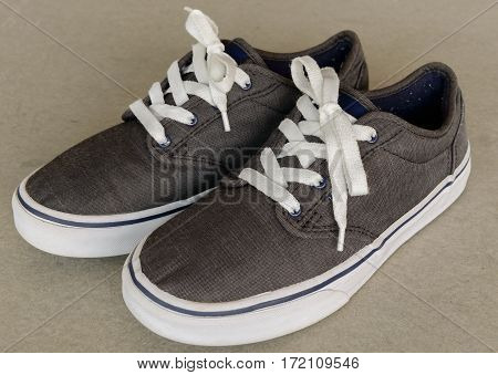 close up vintage style of sport gray sneaker shoe on white gray background