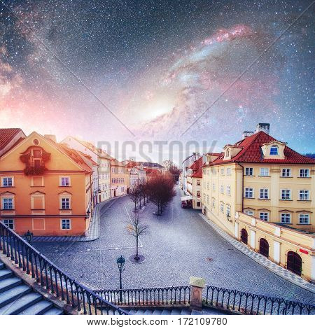 Fantastic starry sky and the milky way. Beautiful houses Czech Republic. Courtesy of NASA.