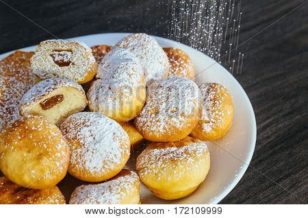 A Lot Of Donuts On The Counter In A Supermarket